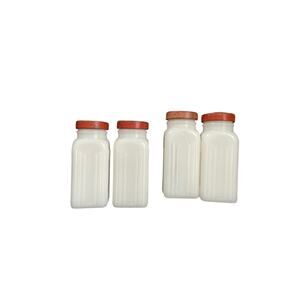 Vintage Milk Glass Spice Jars with Red Lids - Set of Four